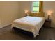 Bedroom with queen bed, two side tables, and a window offering natural light at 4325 Dawning Ln, Douglasville, GA 30135