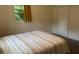 This bedroom features neutral carpet and a double door closet. A window allows for plenty of light into the room at 4325 Dawning Ln, Douglasville, GA 30135