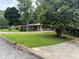 Lovely single-story home with a well-maintained lawn and a convenient two-car garage at 4325 Dawning Ln, Douglasville, GA 30135