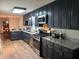 Kitchen boasts granite countertops, a gas range, and stainless steel appliances at 4325 Dawning Ln, Douglasville, GA 30135