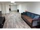 This living room has modern flooring and a blue couch at 4325 Dawning Ln, Douglasville, GA 30135