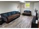 The living room has hardwood floors, a couch, and a modern lamp at 4325 Dawning Ln, Douglasville, GA 30135