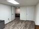 This unfurnished bonus room has sleek flooring and white walls at 4325 Dawning Ln, Douglasville, GA 30135
