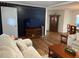 Living room view shows hardwood floors and open floor plan at 4325 Dawning Ln, Douglasville, GA 30135