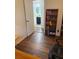 Office featuring wood floors, a doorway to the bathroom, and a built-in bookshelf at 4325 Dawning Ln, Douglasville, GA 30135