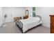 Simple bedroom featuring a black metal bed frame and minimal decor at 5070 Hensley Dr, Atlanta, GA 30338