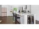 Modern kitchen with white cabinets, quartz countertops, stainless steel appliances, and kitchen island at 5070 Hensley Dr, Atlanta, GA 30338
