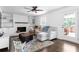 Cozy living room with white brick fireplace, hardwood floors, and comfortable seating arrangement at 5070 Hensley Dr, Atlanta, GA 30338