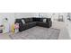 Cozy living area with a large sectional sofa and stylish area rug at 5070 Hensley Dr, Atlanta, GA 30338