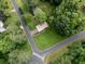 Aerial view showcases a beautiful home with a lush green yard and quiet surroundings at 629 Silver Trace Ct, Woodstock, GA 30189