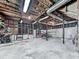Unfinished basement with exposed beams and utilities, offering ample storage or renovation potential at 629 Silver Trace Ct, Woodstock, GA 30189