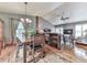 Dining area with hardwood floors, view to the living room and access to the back deck at 629 Silver Trace Ct, Woodstock, GA 30189