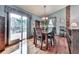 Dining room with hardwood floors, sliding doors to deck, statement lighting and neutral walls at 629 Silver Trace Ct, Woodstock, GA 30189