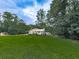 Charming single-Gathering home with a manicured lawn and mature trees at 629 Silver Trace Ct, Woodstock, GA 30189