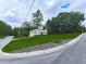 Well-manicured front yard with lush green grass, shrubbery, and a quaint home set back from the street at 629 Silver Trace Ct, Woodstock, GA 30189