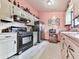 Inviting kitchen featuring vintage cabinetry, modern appliances, and functional layout at 629 Silver Trace Ct, Woodstock, GA 30189