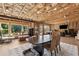Large unfinished basement with wood flooring and exposed framework and a large dining table at 1820 Primrose Park Rd, Sugar Hill, GA 30518
