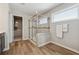 Bathroom featuring a glass enclosed shower, wood look floors, and a walk-in closet for ample storage at 1820 Primrose Park Rd, Sugar Hill, GA 30518