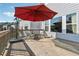 Back deck featuring outdoor seating, an umbrella, and great views of the surrounding homes at 1820 Primrose Park Rd, Sugar Hill, GA 30518