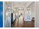 Inviting foyer with hardwood floors and an open view to the living area at 1820 Primrose Park Rd, Sugar Hill, GA 30518