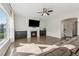 Inviting living room featuring a fireplace, plush seating, and natural light at 1820 Primrose Park Rd, Sugar Hill, GA 30518