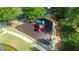 Aerial view of a playground with a slide, play structure, and seating at 1820 Primrose Park Rd, Sugar Hill, GA 30518