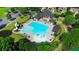 Aerial view of community pool with slide, splash pad, and seating areas at 1820 Primrose Park Rd, Sugar Hill, GA 30518