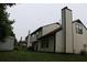 Backyard view featuring ample green space with adjacent neighboring homes at 3255 Hunters Crossing Pt, Lithonia, GA 30038