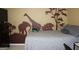 Bedroom featuring decorated walls, a large bed, and carpet at 3255 Hunters Crossing Pt, Lithonia, GA 30038