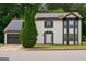 Charming two-story home boasts solar panels, a front-entry garage, and a well-manicured lawn at 3255 Hunters Crossing Pt, Lithonia, GA 30038