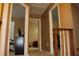 Hallway between rooms with neutral paint and trim at 3255 Hunters Crossing Pt, Lithonia, GA 30038