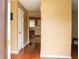 Entry hall with wood flooring and kitchen featuring adjacent eat-in nook at 3255 Hunters Crossing Pt, Lithonia, GA 30038