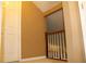 Upstairs hallway features white doors and trim with neutral walls at 3255 Hunters Crossing Pt, Lithonia, GA 30038