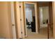 Hallway featuring neutral walls, and multiple doorways at 3255 Hunters Crossing Pt, Lithonia, GA 30038