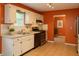 Functional kitchen with white cabinets, stainless steel appliances, and adjacent eat-in nook at 3255 Hunters Crossing Pt, Lithonia, GA 30038