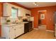 Bright kitchen featuring white cabinetry, stainless steel appliances, and tile flooring at 3255 Hunters Crossing Pt, Lithonia, GA 30038