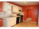 Functional kitchen with white cabinets, stainless steel appliances, and adjacent eat-in nook at 3255 Hunters Crossing Pt, Lithonia, GA 30038
