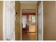 View through doorway to the kitchen features white cabinets and tile floors at 3255 Hunters Crossing Pt, Lithonia, GA 30038