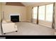 Spacious living area offers abundant natural light and a cozy fireplace at 3255 Hunters Crossing Pt, Lithonia, GA 30038