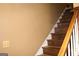 Carpeted staircase with wooden banister at 3255 Hunters Crossing Pt, Lithonia, GA 30038