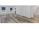 Spacious finished basement with modern flooring and neutral tones, offering versatility for various uses at 3541 Wilton Ave, Atlanta, GA 30340