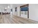 Finished basement showcasing the open layout and stylish wood-look floors, creating a warm and inviting space at 3541 Wilton Ave, Atlanta, GA 30340