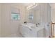 Bright bathroom with double sinks, large mirror, and natural light from window at 3541 Wilton Ave, Atlanta, GA 30340
