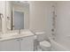 Bright bathroom features a vanity with white cabinets and a bathtub with shower at 3541 Wilton Ave, Atlanta, GA 30340