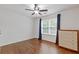 Bedroom featuring a ceiling fan, natural light, hardwood floors and closet at 3541 Wilton Ave, Atlanta, GA 30340