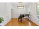 Elegant dining room with hardwood floors, detailed trim, and a modern chandelier, offering a refined space at 3541 Wilton Ave, Atlanta, GA 30340