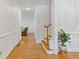 Inviting foyer with hardwood floors, wainscoting, and a staircase leading to the upper level of the home at 3541 Wilton Ave, Atlanta, GA 30340