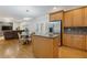 Open kitchen with stainless appliances, granite counters, wooden cabinets, and hardwood floors at 3541 Wilton Ave, Atlanta, GA 30340
