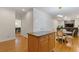 Kitchen island with granite countertop, hardwood floors, and adjacent dining area at 3541 Wilton Ave, Atlanta, GA 30340
