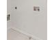 A white laundry room with hookups visible in the wall ready for appliances at 3541 Wilton Ave, Atlanta, GA 30340